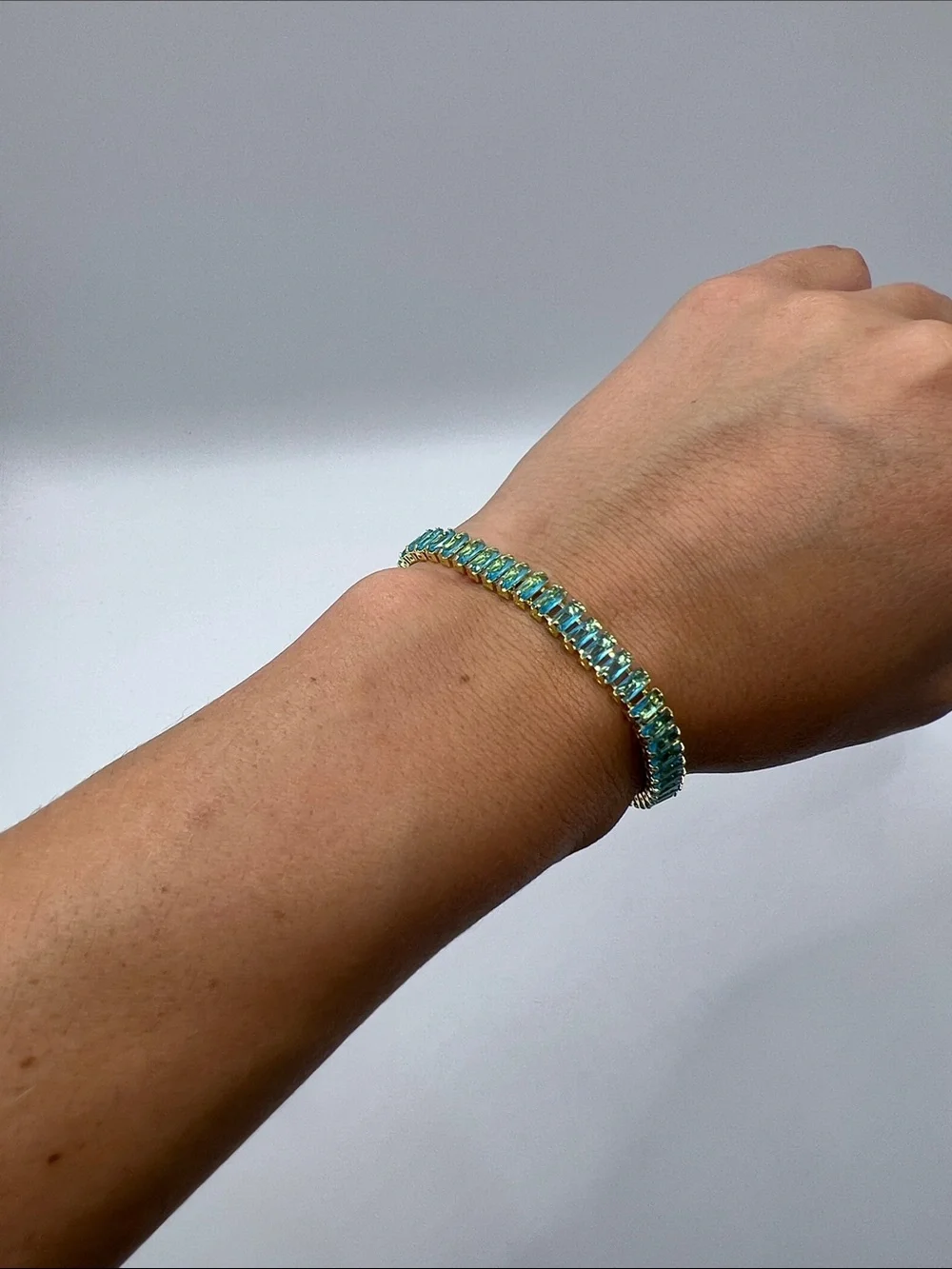 524. 18k Gold Plated over Brass Bracelet with Aquamarine Cubic Zirconias 7”